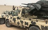 Des miliciens locaux appartenant à un groupe opposé à l'homme fort libyen Khalifa Haftar auprès de véhicules saisis aux forces de ces derniers sur une de leurs bases située à Zawiya, le 5 avril 2019. (Crédit : Mahmud TURKIA / AFP)