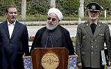 Le président Hassan Rouhani, au centre, durant une conférence de presse après une réunion du cabinet, avec le vice-président Eshaq Jahangiri, à gauche, et le ministre de la Défense, le général Amir Hatami à Téhéran, le 18 mars 2019. (Crédit : Présidence iranienne via AP)