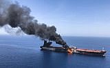 Un pétrolier en feu en mer d'Oman, le 13 juin 2019. (Crédit : AP)