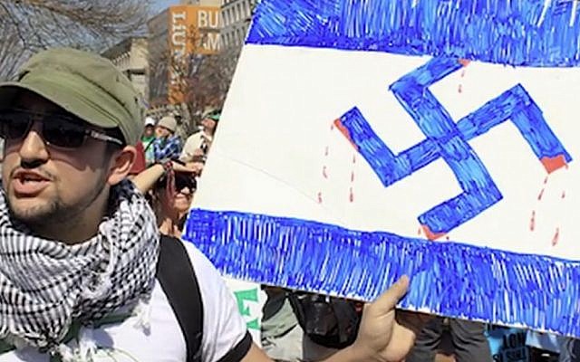 A titre d'illustration : Capture d'écran d'un homme tenant une croix gammée lors d'un événement marquant le Yom HaAtsmaout, Jour de l'indépendance d'Israël, à l'Université du Wisconsin-Milwaukee. (Twitter) A titre d'illustration : Capture d'écran d'un homme tenant une croix gammée lors d'un événement marquant le Yom HaAtsmaout, Jour de l'indépendance d'Israël, à l'Université du Wisconsin-Milwaukee. (Twitter)