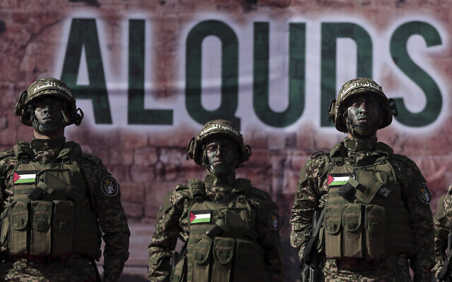 Palestinian members of the Qassam brigades, the militia wing of Hamas movement, attend a rally marking the 30th anniversary of their group, in Gaza City, Thursday, Dec. 14, 2017. (AP Photo/ Khalil Hamra)