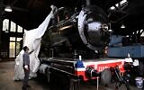La locomotive de l'Orient Express à Longueville, pendant sa restauration pour son exposition à Singapour, le 20 octobre 2020. (Crédit : Anne-Christine POUJOULAT / AFP)