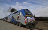 Photo d'illustration : Un train parcourt pour la première fois la nouvelle ligne ferroviaire reliant l'est de l'Iran à l'ouest de l'Afghanistan à la gare de Khaf, le 10 décembre 2020. (Crédit : Mohammed RAMEZANI / ISNA / AFP)