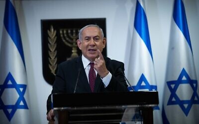 Le Premier ministre Benjamin Netanyahu fait une déclaration télévisée à la Knesset à Jérusalem, le 22 décembre 2020. (Yonatan Sindel/Flash90) Le Premier ministre Benjamin Netanyahu fait une déclaration télévisée à la Knesset à Jérusalem, le 22 décembre 2020. (Yonatan Sindel/Flash90)