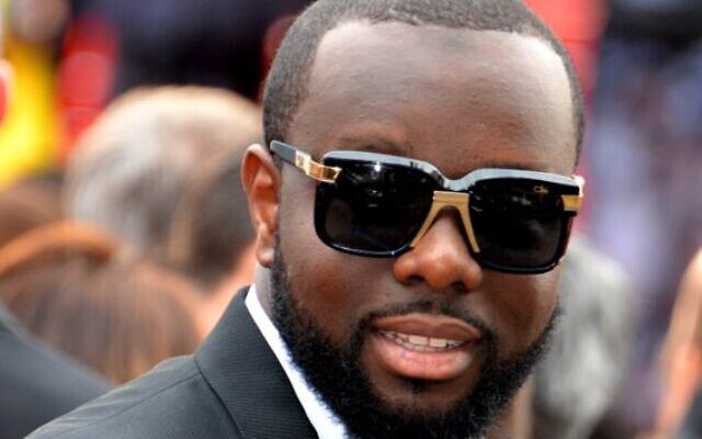 Le rappeur Gims lors du Festival de Cannes 2016. (Crédit : Wikimedia)