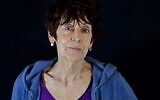 L'artiste visuelle française Annette Messager pose pour un portrait au musée d'art de Tel Aviv, le 23 février 2022. (Crédit : RONALDO SCHEMIDT / AFP)
