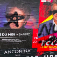 Des tags sur des affiches à Bayonne, le 30 janvier 2022. (Crédit : Fabien Roussel / Twitter)