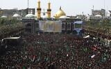 Des milliers de musulmans chiites participent au deuil de l'Achoura au sanctuaire de l'imam Hussein dans la ville sainte irakienne de Karbala, le 20 septembre 2018. (Crédit : AFP PHOTO / AHMAD AL-RUBAYE)