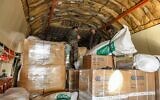 Des colis d'aide humanitaire fournis par l'Arabie saoudite aux victimes du tremblement de terre du 6 février déchargés d'un avion de transport Ilyushin Il-76TD à l'aéroport international d'Alep, dans le nord de la Syrie, le 14 février 2023.(Crédit : AFP)
