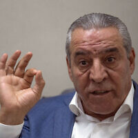 Le secrétaire général du comité exécutif de l'OLP, Hussein al-Cheikh, accordant une interview à l'Associated Press dans son bureau de Ramallah, le 13 juin 2022. (Crédit : Nasser Nasser/AP Photo)