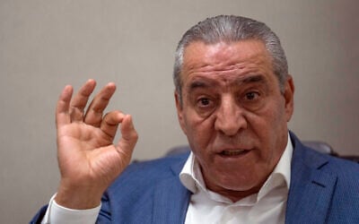 Le secrétaire général du comité exécutif de l'OLP, Hussein al-Cheikh, accordant une interview à l'Associated Press dans son bureau de Ramallah, le 13 juin 2022. (Crédit : Nasser Nasser/AP Photo)