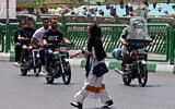 Une iranienne voilée, à Téhéran, le 18 juillet 2017. (Crédit : ATTA KENARE / AFP)