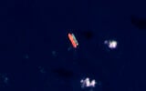 Des navires identifiés comme le Virgo, à gauche, et le Suez Rajan, par le groupe de pression United Against Nuclear Iran, en mer de Chine méridionale, le 13 février 2022. (Crédit : Planet Labs PBC via AP/Dossier)