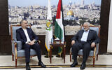 Le ministre des Affaires étrangères de l'Iran, Hossein Amir-Aabdollahian (à gauche) rencontrant Ismaïl Haniyeh, l'un des dirigeants du groupe terroriste palestinien Hamas à Doha, au Qatar, le 14 octobre 2023. (Crédit : ministère des Affaires étrangères iranien/AP)