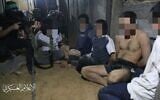 Des ressortissants étrangers détenus par des hommes armés du Hamas, sur une photo non confirmée diffusée sur les médias sociaux. (Autorisation)