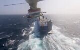 Les Houthis du Yémen, soutenus par l'Iran, ont publié une vidéo montrant comment le groupe avait détourné un navire de transport lié à Israël dans la mer Rouge, le 20 novembre 2023. (Crédit : Capture d'écran X)