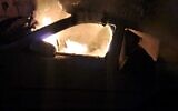 Une voiture incendiée au village palestinien de Burqa, dans le nord de la Cisjordanie, le 19 février 2024. (Autorisation : municipalité de Burqa)