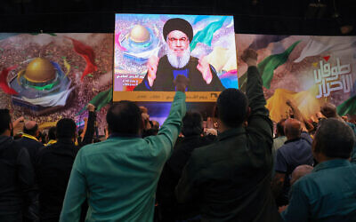 Le secrétaire-général du Hezbollah, Hassan Nasrallah, lors d'un discours télévisé pendant un rassemblement marquant la journée annuelle al-Quds (Journée de Jérusalem) dans un quartier du sud de Beyrouth, le 5 avril 2024. (Crédit : Anwar Amro/AFP)