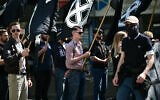 Des membres du groupe d'extrême droite "Comité du 9 Mai" manifestent pour commémorer le 30e anniversaire de la mort de Sébastien Deyzieu, militant du groupe ultranationaliste "Œuvre française", à Paris, le 11 mai 2024. (Crédit : MIGUEL MEDINA / AFP)