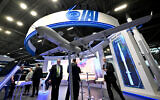 Des visiteurs sur le stand d'Israel Aerospace Industries (IAI), au salon international de la défense terrestre et aérienne et de la sécurité Eurosatory, à Villepinte, dans la banlieue nord de Paris, le 13 juin 2022. (Crédit : Emmanuel Dunand/AFP)