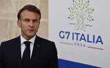 Le président français Emmanuel Macron s'adressant à la presse lors du sommet du G7, à Fasano, dans le sud de l'Italie, le 13 juin 2024. (Crédit : Ludovic Marin/AFP)