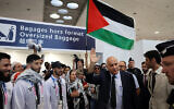 Jibril Rajoub, président de la Fédération palestinienne de football et du Comité olympique palestinien, des athlètes olympiques palestiniens et des membres de la délégation arrivant à l'aéroport Charles-de-Gaulle, au nord de Paris, le 25 juillet 2024. (Crédit : Ahmad Gharabli/AFP)