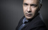 L'écrivain et journaliste algérien Kamel Daoud pose lors d'une séance photo à Paris, le 20 février 2017. (Photo JOEL SAGET / AFP)