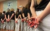 Des femmes habillées comme l'otage Naama Levy soulignent les abus subis par les personnes détenues en captivité à Gaza, lors d'une réunion de la Commission de la Knesset sur le statut des femmes et l'égalité des sexes, Jérusalem, 28 octobre 2024 (Sam Sokol/Times of Israel).