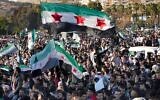 Des Syriens lors de la première prière du vendredi depuis l'éviction de Bashar el-Assad, sur la place centrale de Damas, en Syrie, le 13 décembre 2024. (Crédit : Hussein Malla/AP)