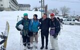 Le consul d'Israël au Japon, Avinoam Mizrahi, deuxième à droite, avec trois hommes israéliens qui avaient été bloqués dans une station de ski de montagne près de Hakuba au Japon, après leur sauvetage, le 7 janvier 2025. (Crédit : Ambassade d'Israël à Tokyo)