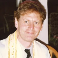 Jeffrey Klein dirigeant le seder en 1990. (Crédit : Famille Klein)