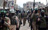 Des membres du Hamas participent au cortège funéraire de Marwan Issa, un haut commandant du Hamas tué en mars 2024 dans le camp de Bureij en proie à la guerre, dans le centre de la bande de Gaza, le 7 février 2025. (Crédit : Eyad BABA / AFP)