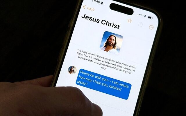 L'application chatbot « Text With Jesus » affichée sur un iPhone le 2 octobre 2025, à Washington, DC. (Crédit : AFP)