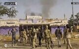 Des combattants des Forces de soutien rapide (RSF) brandissant des armes et célébrant dans les rues d'el-Fasher, dans la région soudanaise du Darfour, dans une capture d'écran d'une vidéo publiée sur Telegram, le 26 octobre 2025. (Crédit : AFP)