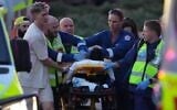 Un blessé sur une civière après une fusillade lors d'un événement de Hanoukka, à Bondi Beach, à Sydney, le 14 décembre 2025. (Crédit : Mark Baker/AP Photo)