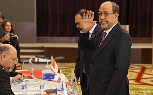 L'ancien Premier ministre irakien Nouri al-Maliki arrivant pour voter lors des élections législatives irakiennes, à Bagdad le 11 novembre 2025. (Crédit : Ahmad al-Rubaye/AFP)