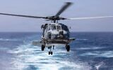 Un hélicoptère MH-60R Sea Hawk s'apprête à atterrir sur le pont du destroyer lance-missiles de classe Arleigh Burke USS Truxtun (DDG 103) lors d'un ravitaillement en mer avec le ravitailleur de classe Henry J. Kaiser USNS Henry J. Kaiser (T-AO-187), le 5 juin 2026. (Photo : US Navy)