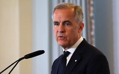 Le Premier ministre canadien Mark Carney prend la parole à l'Economic Club de New York le 28 mai 2026. (Crédit : Angela Weiss/AFP)