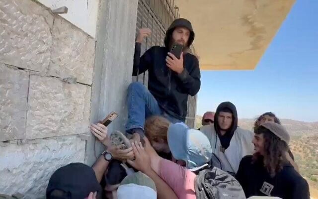 Solidarity activists work to block settlers from entering a building in the West Bank village of Jurish, July 17, 2026. (X video/used in accordance with Clause 27a of the Copyright Law)