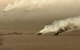 Cette photo diffusée le 15 septembre 2026 par l'Ansarullah Media Center des Houthis montrerait, selon certaines sources, des véhicules militaires en feu qu'ils auraient pris pour cible dans la province d'al-Jawf, en Arabie saoudite. (Crédit : ANSARULLAH MEDIA CENTER/AFP)