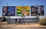 Des militants du Likud accrochant des affiches de campagne du Premier ministre Benjamin Netanyahu à côté d’un panneau publicitaire représentant son rival de l’opposition, Gadi Eisenkot, à l’approche des élections législatives israéliennes à Dimona, dans le sud d’Israël, le 21 octobre 2026. (Crédit : Ohad Zwigenberg/AP Photo)