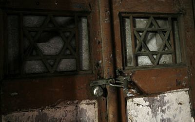 Locked synagogue door (illustration) (phot credit: by Miriam Alster/Flash90)