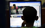 Illustrative: A child using a computer (Yossi Zamir/Flash 90)