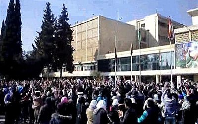 Syrian students protest against Bashar Assad at Aleppo University on Thursday (Local Coordination Committees in Syria/AP)