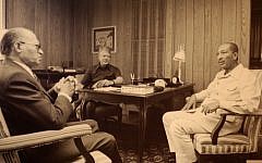 Prime Minister Menachem Begin, left, with President Jimmy Carter, center, and President Anwar Sadat of Egypt at Camp David in September 1978. (CC BY-SA Jeff Kubina/Flickr)