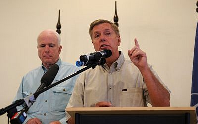 Republican Senators Lindsey Graham, right, and John McCain (photo credit: CC BY isafmedia/Flickr)