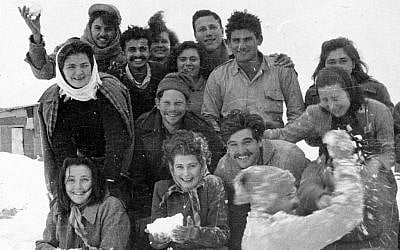 Working alone, Nadav Mann has collected more than 100,000 photographs documenting Israel's early years, an archive unparalleled anywhere in the country. In this photograph, the first settlers at Kibbutz Malkiya celebrate their first snow, circa 1949. From the collection of Ferol and Rivkaleh Atzmon. (photo credit: Courtesy of Nadav Mann/Bitmuna)
