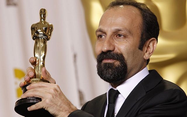Asghar Farhadi, from Iran, poses with his award for best foreign language film. (photo credit: AP/Joel Ryan)
