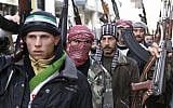 Syrian rebels march in a show of strength during a demonstration in Idlib, Syria (photo credit: AP)