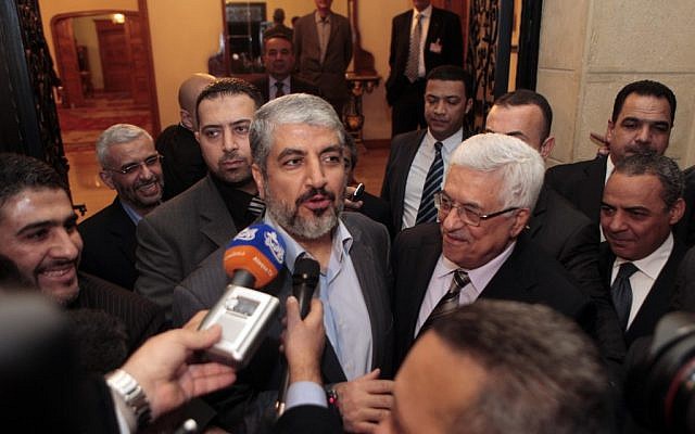 Mahmoud Abbas (center right) and Hamas leader Khaled Mashaal speak to reporters after talks in Cairo in February 2012 (photo credit: Amr Nabil/AP) Mahmoud Abbas (center right) and Hamas leader Khaled Mashaal speak to reporters after talks in Cairo in February 2012 (photo credit: Amr Nabil/AP)